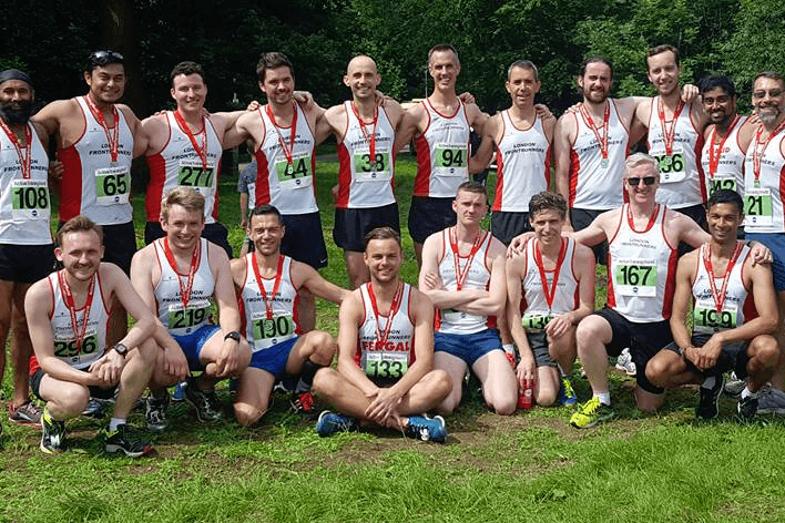 Group of London frontrunners with medals after a race